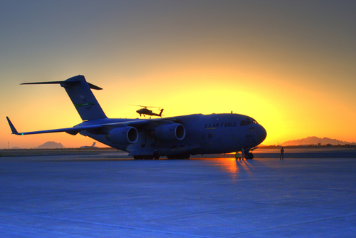 AH64 passing USAF C-17